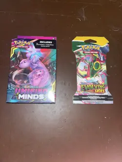 Pokemon Unified Minds 3 Pack Hanger Box + Evolving Skies Sleeved Booster - Image 1