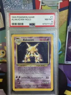 Pokemon TCG Alakazam Base Set Holo Card 1/102 PSA 8 - Image 1