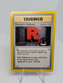 Rocket’s Hideout 63/64 Neo Revelation Uncommon Stadium Trainer Pokemon Card - LP - Image 1