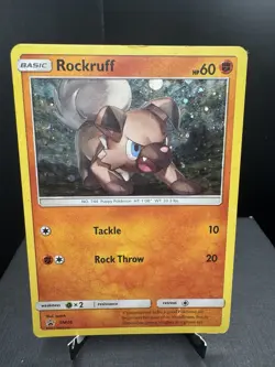 Pokemon TCG Sun & Moon Rockruff SM06 Cosmos Holo Black Star Promo HP - Image 1