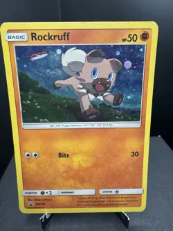 Pokemon TCG Sun & Moon Rockruff SM120 Cosmos Holo Black Star Promo LP - Image 1