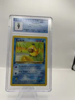 Psyduck 53/62 1st Edition CGC 9 Pokemon Fossil - Image 1