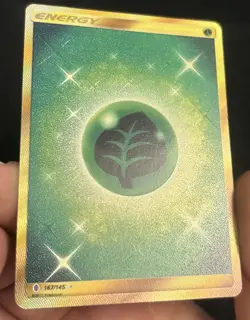 Pokemon TCG Gold Grass Leaf Energy Secret Rare 167/145 Sm Guardians Rising Holo - Image 1