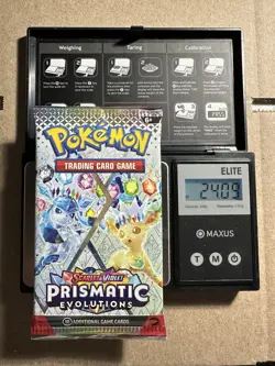 Pokemon Prismatic Evolutions Booster Pack -HEAVY 24.09g- Possible Demi/God Pack! - Image 1