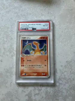 PSA 8 Charizard Pokemon 2004 Meiji Chocolate Promo Japanese 054/ADV-P Mint - Image 1