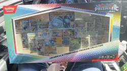 PRISMATIC EVOLUTIONS Lucario EX and Tyranitar EX Premium Collection Sam’s Club - Image 1