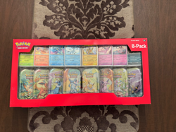 Pokemon TCG: Scarlet & Violet - Prismatic Evolutions 8 Pack Mini Tin Set Costco - Image 1