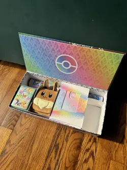 Pokemon Prismatic Evolutions SPC Box ( Box, Playmat, Eevee Pouch, Sleeves Only) - Image 1