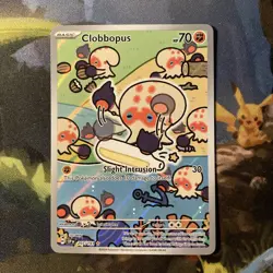 Clobbopus (Surging Sparks 207/191) Illustration Rare Pokemon card - Image 1