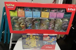 Pokemon Prismatic Evolutions Tins and Surging Sparks Cards Costco - 1 each - Image 1