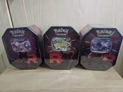 (reserved )Pokemon Tcg Team Rocket Tins 4 Set Of 3 - Image 1