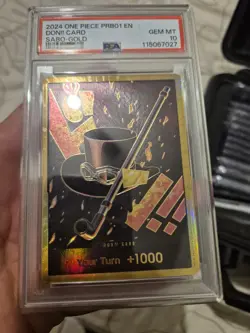 2024 DON!! CARD SABO GOLD ONE PIECE PRB01-PREMIUM BOOSTER THE BEST PSA 10 GEM - Image 2