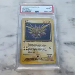 1999 Pokemon Fossil #30 Zapdos 1st Edition PSA 8 NM-MT - Image 1
