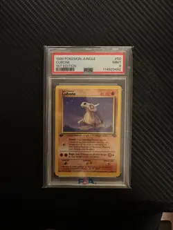 Cubone 50/64 1ST EDITION PSA 9 POKEMON JUNGLE SET COMES WITH 2 RANDOM HOLOS - Image 1