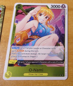 ONE PIECE WINGS OF CAPTAIN ENGLISH CARD GAME HOLO CARTE O-NAMI OP06-101 R EN M - Image 1