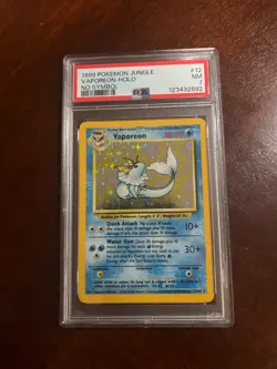 1999 POKEMON JUNGLE NO SYMBOL #12 VAPOREON-HOLO PSA 7 - Image 1