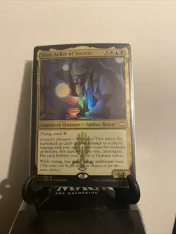 Tivit, Seller of Secrets Commander: Streets of New Capenna Foil - Image 1