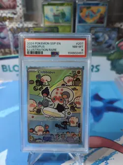 Clobbopus 207/191 Surging Sparks Illustration Rare Holo Pokemon - PSA8 - Image 1