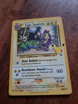 Pokemon Light Toxtricity Swsh137 25th Anniversary Card Holo regular size - Image 1