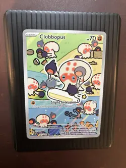 Clobbopus 207/191 Surging Sparks Illustration Rare Holo Pokemon NM - Image 1