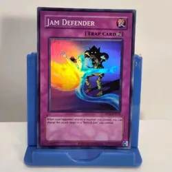 Jam Defender RP02-EN036 Retro Pack 2 Unlimited Super Rare Yugioh TCG - Image 1