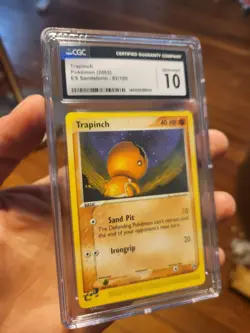 (POP 19) CGC 10 GEM MINT 2003 Pokemon Ex Sandstorm 82/100 Trapinch Card - Image 1
