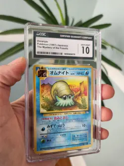 CGC 10 GEM MINT Pokemon 1997 Japanese Mystery Of The Fossil Omanyte Card #138 - Image 1