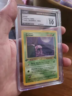 CGC 10 GEM MINT Grimer 48/62 Fossil 1st Edition Pokemon Card WOTC 1999 - Image 1