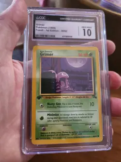 CGC 10 GEM MINT Grimer 48/62 Fossil 1st Edition Pokemon Card WOTC 1999 - Image 2