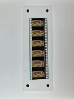 Framed Mew and Mewtwo 35mm film reel from 1999 Mewtwo Strikes Back Pokemon Movie - Image 1