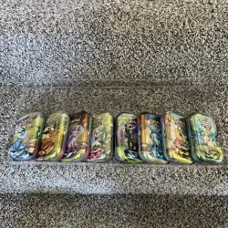 BRAND NEW Pokemon Prismatic Evolutions | Empty Mini Tins With Coins And Art Card - Image 1