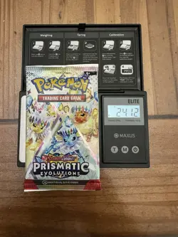 Pokemon Prismatic Evolutions Booster Pack -HEAVY 24.12g- Possible Demi/God Pack! - Image 1