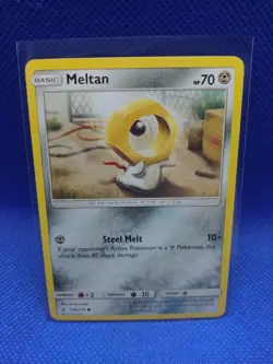 Meltan - 128/214 - Unbroken Bonds - SM - Common - Pokemon TCG Card - NM - Image 1