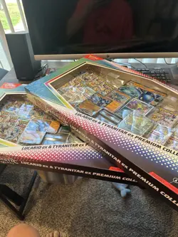 Prismatic Evolutions Lucario Ex & Tyranitar Ex Premium Collection - Sam’s Club - Image 1