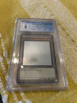 CGC-graded "Mint 9" Red-Eyes Black Dragon Yu-Gi-Oh! trading card from the 2022 " - Image 1