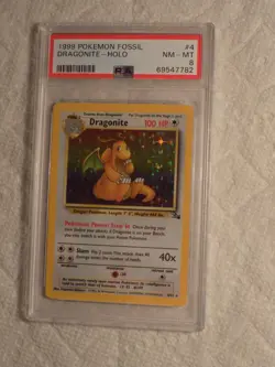 1999 POKEMON PSA 8 NM/MT FOSSIL DRAGONITE HOLOFOIL #4 - Image 1
