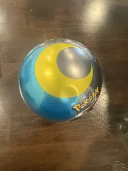 H24 Pokemon TCG Moon Ball Tin With Small Dent - Image 1