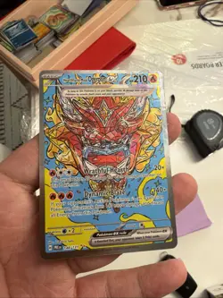Hearthflame Mask Ogerpon EX Prismatic Evolutions Holo Pokemon TCG Card 148/131 - Image 1