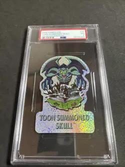 PSA 7 2002 Yu-Gi-Oh Series 1 SandyLion Toon Summoned Skull #25 Prismatic Sticker - Image 1