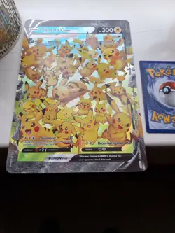 Pokemon 25th Anniversary Oversized Pikachu V Union Swsh Black Star Promo in hand - Image 1