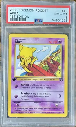 Pokemon 2000 Rocket ABRA 1ST Edition #49 PSA 8 - Image 1