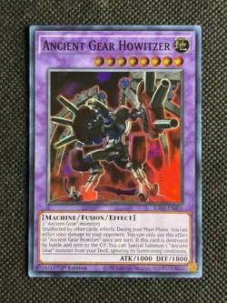 YuGiOh! - Ancient Gear Howitzer RA03-EN035 Super Rare 1st Edition Near Mint - Image 1