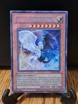 Yugioh RP02-EN095 Secret Rare Light and Darkness Dragon REPRINT Foil Bleed NM - Image 1