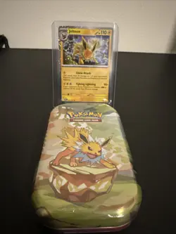 Pokemon Costco Prismatic Evolutions TCG Mini Tin Sealed + Jolteon Foil Card - Image 1