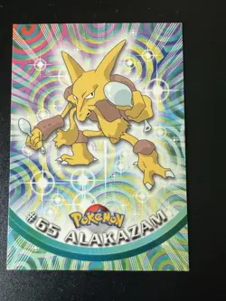 #65 Alakazam - Pokemon Topps Card - Red Logo - Image 1