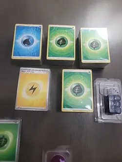 Pokemon Energy Card Lot - Unopened block Packages, Dice, Coins, 2 Empty Boxes - Image 1