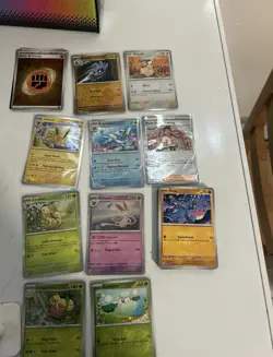 Pokemon Prismatic evolutions card lot with an assortment of bulk all NM+ - Image 1