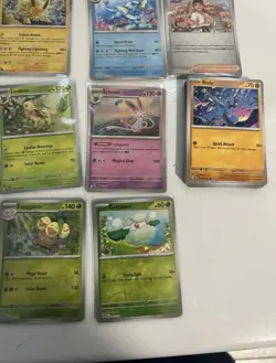 Pokemon Prismatic evolutions card lot with an assortment of bulk all NM+ - Image 3