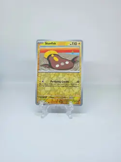 064/191 STUNFISK | COMMON REVERSE HOLO | SURGING SPARKS POKEMON CARD - Image 1