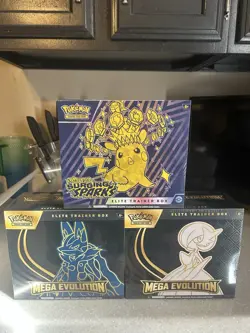 Pokemon Surging Sparks Elite Trainer Box And 2 Pokemon Mega Evolution ETBs - Image 1